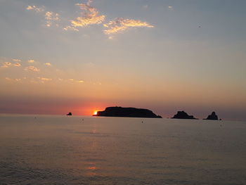 Scenic view of sea against sky at sunset