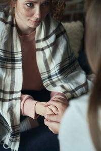 Midsection of woman with eyes closed