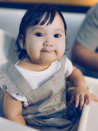 Beautiful young little baby girl posing for the camera.