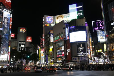 Illuminated city street at night