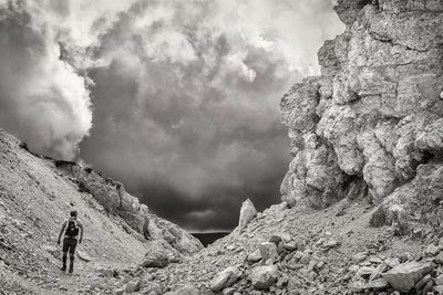 Low angle view of mountain against cloudy sky