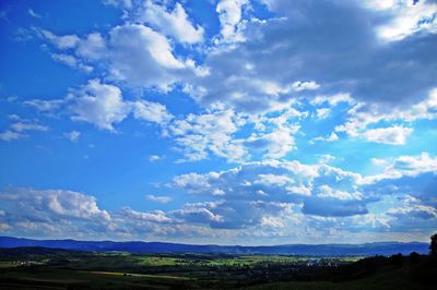 Scenic view of landscape against blue sky
