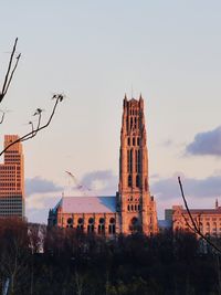 Low angle view of buildings against sky during sunset