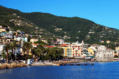 Scenic view of cinque terre by sea