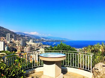 Scenic view of sea against clear blue sky