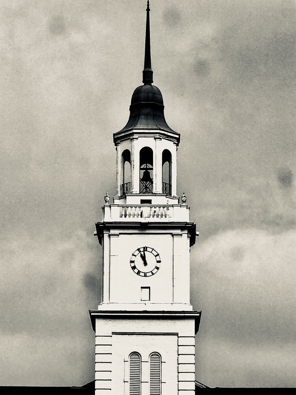LOW ANGLE VIEW OF CLOCK TOWER ON BUILDING AGAINST SKY