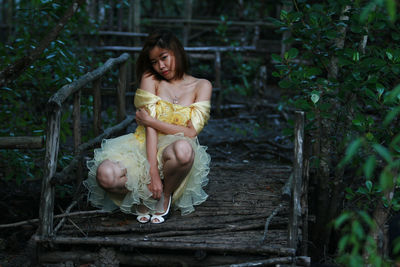 Young woman posing in dress outdoors