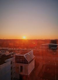 High angle view of buildings against sky during sunset