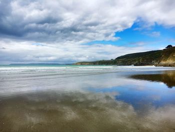 Scenic view of beach against sky