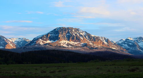 Scenic view of snowcapped mountains against sky