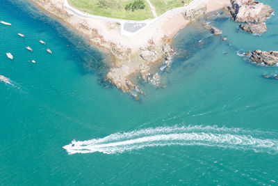 Aerial shot of the sea and island on a sunny day