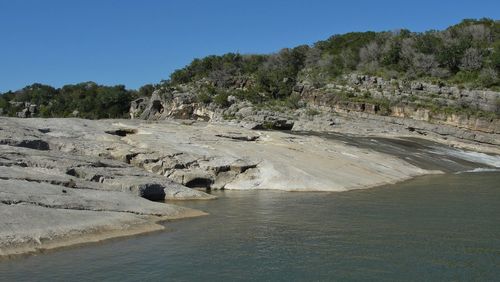 Scenic view of land against clear blue sky