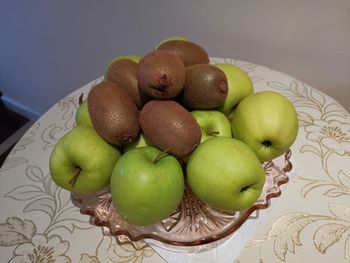 High angle view of apples in basket on table