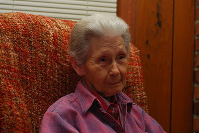 Senior woman sitting in chair