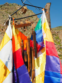 Clothes drying against blue sky