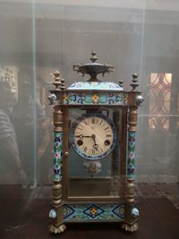 Close-up of clock on wall in building