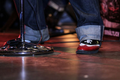 Low section of man standing on stage