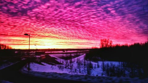 Scenic view of dramatic sky at sunset