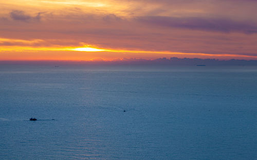 Scenic view of sea against sky during sunset