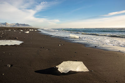 Scenic view of beach against sky