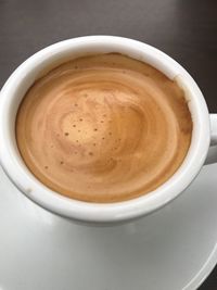 High angle view of cappuccino on table