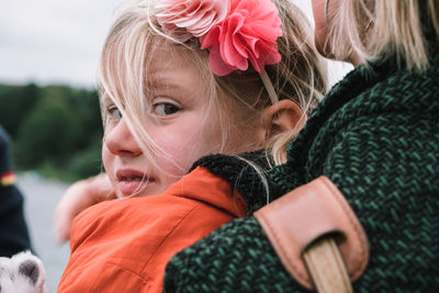 Close-up portrait of cute girl in winter