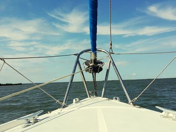 Ship sailing on sea against sky