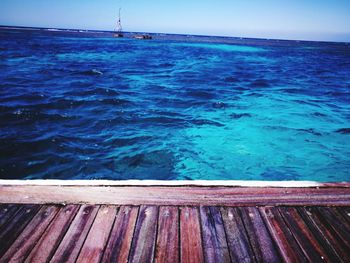 Scenic view of swimming pool by sea against sky