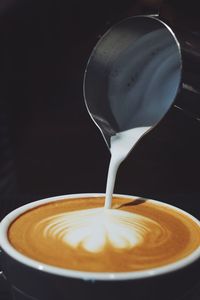 Close-up of cappuccino on table