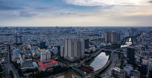 High angle view of buildings in city against sky