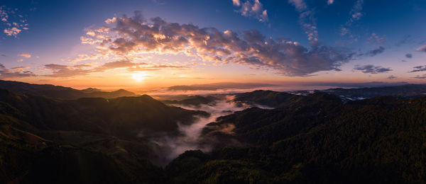 Scenic view of mountains against sky during sunset