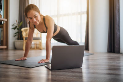 Young woman using laptop at office