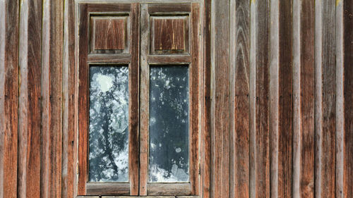 Closed wooden door of building