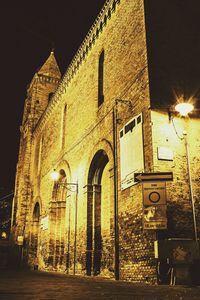 Low angle view of illuminated street light at night