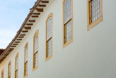 Low angle view of residential building against clear sky