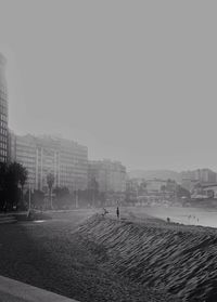 View of city beach against sky