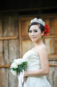 Close-up of bride with rose bouquet