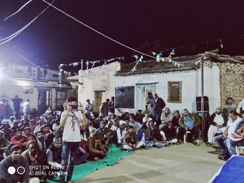 People on street in city at night