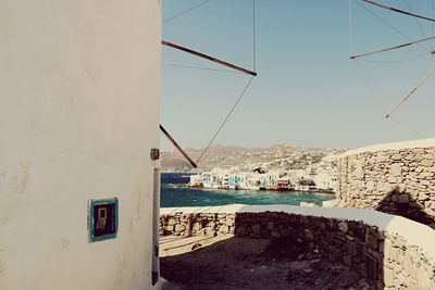 View of town by sea against clear sky