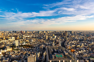 High angle view of city buildings against sky