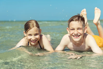 Portrait of happy boy in swimming pool