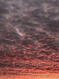 Low angle view of dramatic sky during sunset