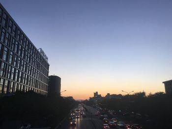 Cars on road at sunset