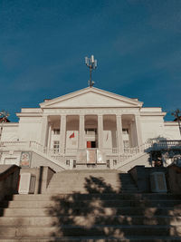 Low angle view of building against blue sky