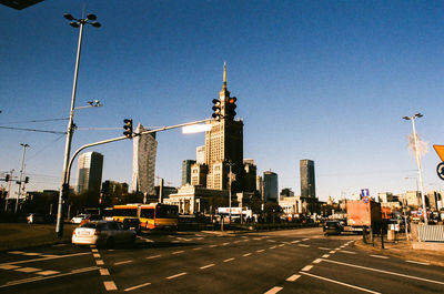 View of city street and buildings against sky