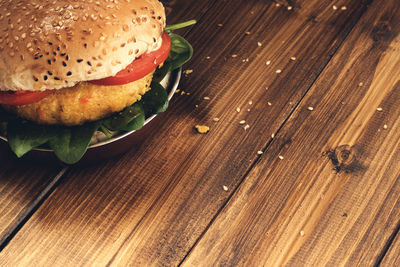 Close-up of vegetarian burger on wooden background