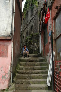 Man on staircase of house