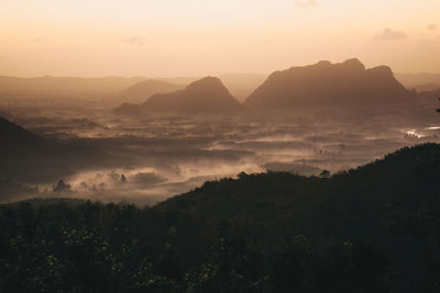 Scenic view of mountains against sky during sunset