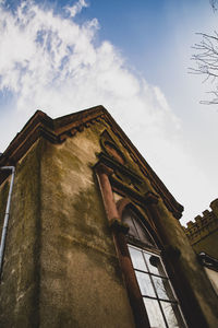 Low angle view of old building against sky