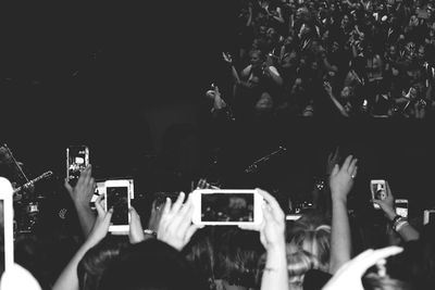 Photographer taking picture of a mobile phone